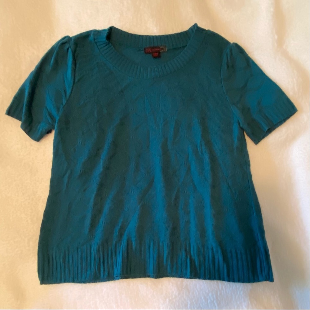 Teal light sweater.